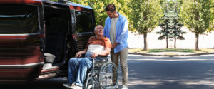 senior in wheelchair with nurse