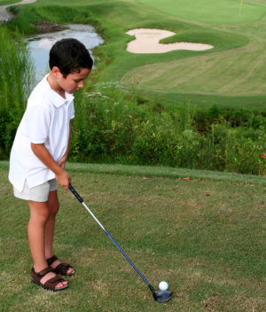 boy playing golf